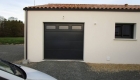 Porte de garage - Menuiserie extérieure - Réalisation de l'entreprise Rousseau Dominique - Coëx